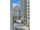 A modern city landscape featuring sleek high-rise buildings on a sunny day, enhanced by landscaped greenery at 449 S 12Th St # 504, Tampa, FL 33602