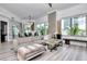 Spacious open-concept living area features modern decor, comfortable seating, and access to an outdoor balcony at 449 S 12Th St # 504, Tampa, FL 33602