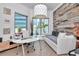 Bright office space with large windows, modern decor, and wood accent wall at 449 S 12Th St # 504, Tampa, FL 33602