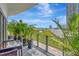 Lush outdoor patio with views of city skyline and green lawn, featuring modern patio furniture and decor at 449 S 12Th St # 504, Tampa, FL 33602