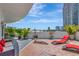 Serene patio features wood floors, lounge chairs, and vibrant potted plants at 449 S 12Th St # 504, Tampa, FL 33602