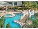 An inviting pool area with a connecting bridge, lounge chairs, and well-maintained landscaping offers a relaxing oasis at 449 S 12Th St # 504, Tampa, FL 33602