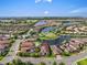 Property aerial showing the lake view, lush landscape, and well-planned community at 4506 Stickley Ct, Palmetto, FL 34221