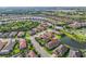 Aerial view showing location within a well-developed community near a large lake at 4506 Stickley Ct, Palmetto, FL 34221