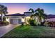 Stunning single-story home featuring a well-manicured lawn, beautiful landscaping and a two-car garage at 4506 Stickley Ct, Palmetto, FL 34221