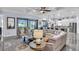 Inviting living room showcasing tile flooring, neutral decor, and sun-filled open floor plan at 4506 Stickley Ct, Palmetto, FL 34221