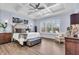 Bright main bedroom with coffered ceiling, wood floors, and large windows at 4506 Stickley Ct, Palmetto, FL 34221