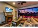 Cozy outdoor patio with fireplace and comfortable seating overlooking a beautiful pool at 4506 Stickley Ct, Palmetto, FL 34221