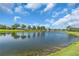 Beautiful lake view from the property, showcasing the serene water and lush landscaping at 4506 Stickley Ct, Palmetto, FL 34221