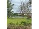 Scenic community view with lush green space and waterfront access, complete with benches for relaxing at 4550 Overlook Ne Dr # 156, St Petersburg, FL 33703