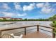 Inviting view of the lake from a wooden dock, perfect for relaxation and enjoying nature at 4550 Overlook Ne Dr # 156, St Petersburg, FL 33703