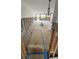 Spacious living room undergoing renovations, with exposed walls and ample natural light, ready for customization at 4550 Overlook Ne Dr # 156, St Petersburg, FL 33703