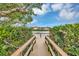 Picturesque water view from a wood dock, showcasing the building across the water at 4550 Overlook Ne Dr # 156, St Petersburg, FL 33703