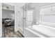 Bright bathroom featuring a soaking tub and a glass enclosed shower at 511 York Dale Dr, Ruskin, FL 33570