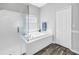 Bright bathroom with a soaking tub, glass shower, and updated tile and fixtures at 511 York Dale Dr, Ruskin, FL 33570