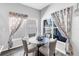 Cozy breakfast nook with natural light, neutral colors, and seating for four at 511 York Dale Dr, Ruskin, FL 33570