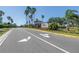Community entrance with lush landscaping, mature palm trees, and clear signage, creating an inviting atmosphere at 511 York Dale Dr, Ruskin, FL 33570