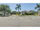 Community center with ample parking, a tennis court, and well-maintained landscaping at 511 York Dale Dr, Ruskin, FL 33570