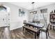 Elegant dining room featuring a modern chandelier, dark wood table, and stylish decor at 511 York Dale Dr, Ruskin, FL 33570