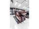 Finished garage area featuring maroon custom motorcycle and epoxy floors at 511 York Dale Dr, Ruskin, FL 33570