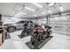 Spacious garage interior featuring multiple motorcycles and a gray SUV at 511 York Dale Dr, Ruskin, FL 33570