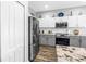 Well-equipped kitchen features stainless appliances, modern cabinets, and a stylish backsplash at 511 York Dale Dr, Ruskin, FL 33570