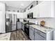 Contemporary kitchen featuring stainless steel appliances, granite countertops, and ample storage space at 511 York Dale Dr, Ruskin, FL 33570