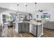 Open-concept kitchen with a granite island, stainless steel dishwasher, and pendant lighting at 511 York Dale Dr, Ruskin, FL 33570