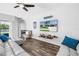 Bright living room with modern decor, wood floors, and a view to the outside at 511 York Dale Dr, Ruskin, FL 33570