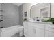 Stylish bathroom with gray tiling, modern vanity, and updated fixtures at 5111 N 30Th St, Tampa, FL 33610