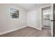 Bedroom featuring new flooring, closet, and window at 5111 N 30Th St, Tampa, FL 33610