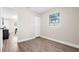 Bedroom featuring new flooring, closet and a sun-filled window at 5111 N 30Th St, Tampa, FL 33610