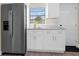 Spacious kitchen featuring stainless steel appliances, white cabinetry, and modern fixtures for culinary enthusiasts at 5111 N 30Th St, Tampa, FL 33610