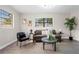 Sunlit living room featuring neutral decor, comfortable seating, and modern touches for a relaxing atmosphere at 5111 N 30Th St, Tampa, FL 33610