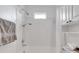 Bright white bathroom featuring shower-tub combo and single sink vanity at 5207 Moeller Ave, Sarasota, FL 34233