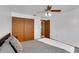 Bedroom featuring a queen size bed, closet, and entrance to another room at 5207 Moeller Ave, Sarasota, FL 34233
