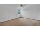 Empty carpeted bedroom with ceiling fan and a window for natural light at 5207 Moeller Ave, Sarasota, FL 34233