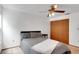 Bedroom with queen size bed, side table, ceiling fan, and closet at 5207 Moeller Ave, Sarasota, FL 34233