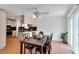 Inviting dining area features neutral walls, a ceiling fan and a wooden dining table perfect for Gathering meals at 5207 Moeller Ave, Sarasota, FL 34233