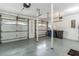 Spacious garage with three garage doors and two support beams at 5207 Moeller Ave, Sarasota, FL 34233