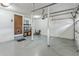 Spacious garage with shelving and access door at 5207 Moeller Ave, Sarasota, FL 34233