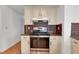 The kitchen has modern appliances, sleek granite countertops, and updated cabinetry, for a contemporary culinary experience at 5207 Moeller Ave, Sarasota, FL 34233