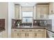Bright kitchen with granite counters and updated appliances; a modern and functional space for cooking and entertaining at 5207 Moeller Ave, Sarasota, FL 34233