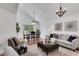 Sunlit open floor plan showcases a dining area and cozy living room, perfect for entertaining or quiet relaxation at 5207 Moeller Ave, Sarasota, FL 34233