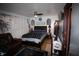 Cozy bedroom with dark wood furniture, ceiling fan, and nautical decor at 6000 20Th N St # 138, St Petersburg, FL 33714