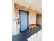 Hallway with Elevator, including tiled floor, textured ceilings, and a seating bench at 6000 20Th N St # 138, St Petersburg, FL 33714