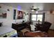 Relaxing living room with decorative accents, TV, and adjacent dining and kitchen area at 6000 20Th N St # 138, St Petersburg, FL 33714