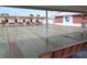Community shuffleboard court with outdoor seating and covered walkways leading to the rec hall at 6000 20Th N St # 138, St Petersburg, FL 33714