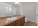 Bathroom featuring a large vanity with tan countertops and tile floors at 662 Petal Mist Ln, Brooksville, FL 34604