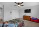 Bedroom featuring light walls, ceiling fan and carpeted floors at 662 Petal Mist Ln, Brooksville, FL 34604